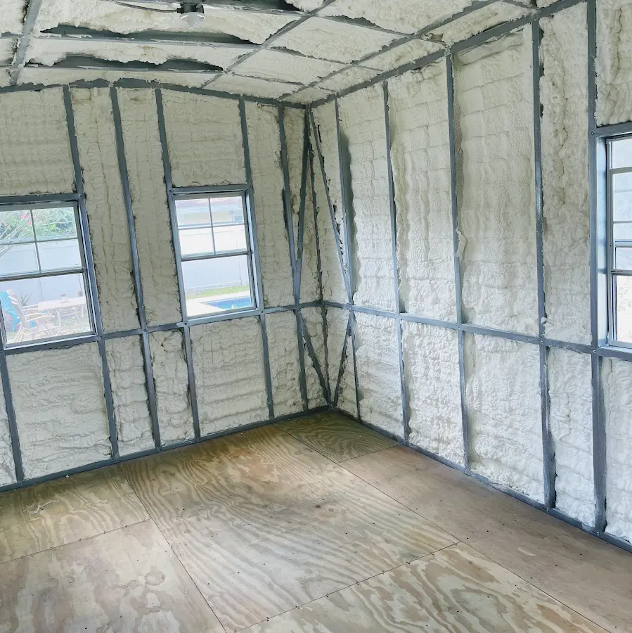 Closed-cell spray foam insulation applied to wall cavities in a residential project in Talladega